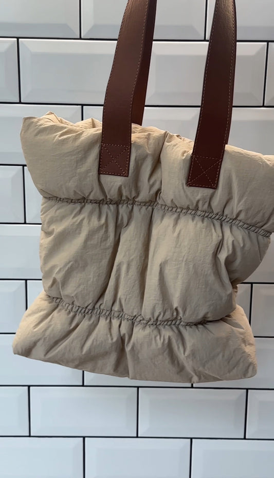 Nude puffer tote bag with tan faux leather strap